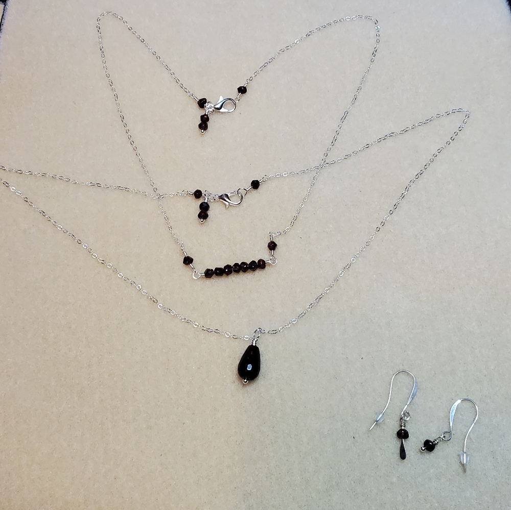 Garnet layering necklaces and earrings